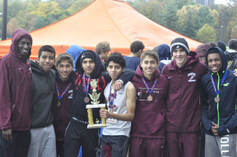 Team sophomore holds the winning trophy after a hard race against Brooklyn tech and Bronx Science