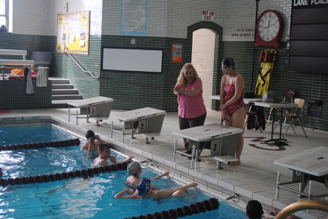 Ms.Boylan instructs her club members during a meeting.