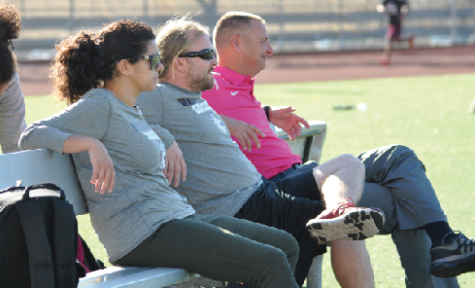 Carla Sigona, Coach Gonzalez and athletic director, Eric Ritzer, watch the girls soccer team during a fall practice.