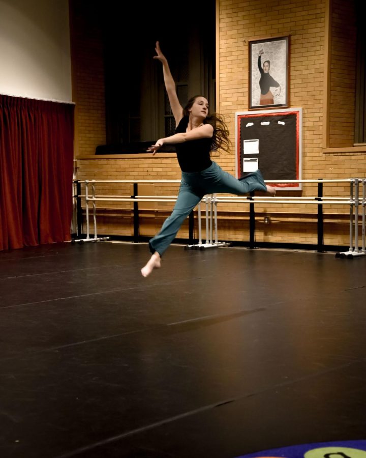 Julia Holtermann, mid jump, during a performance at the dedication of the new dance room. 