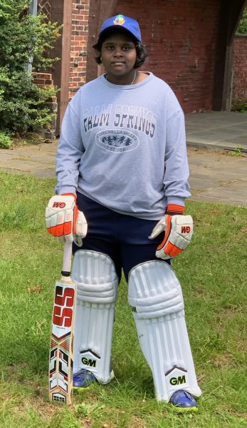 Cricket player Nadiya Kumaravel poses in her gear.
