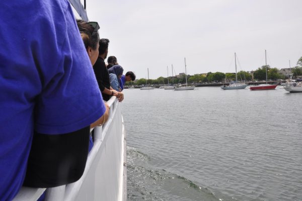 Students look on as the boat begins to move out of the bay.