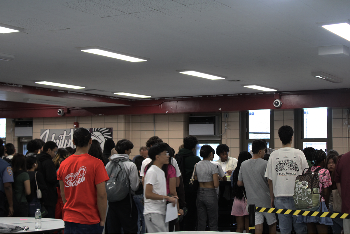 Students receiving Yondr pouches and schedules.
